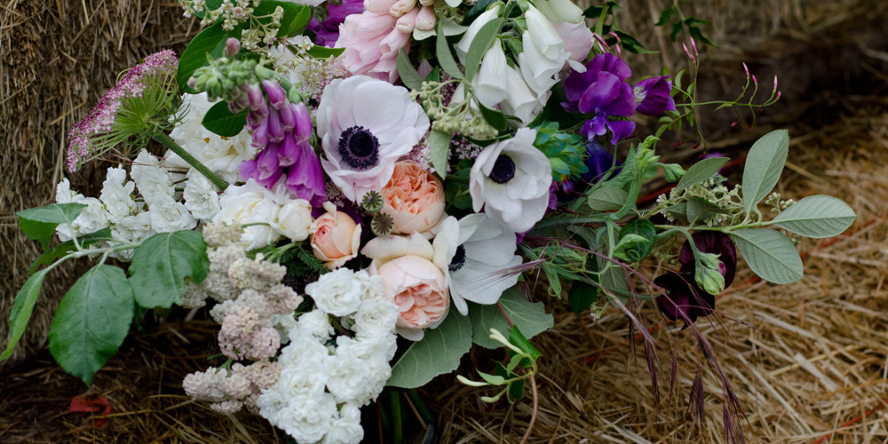 farmer florist purple brides bouquet spring anemones roses sweetpeas